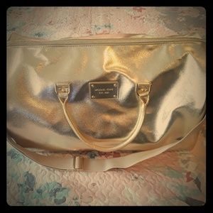 Michael Kors gold duffel bag